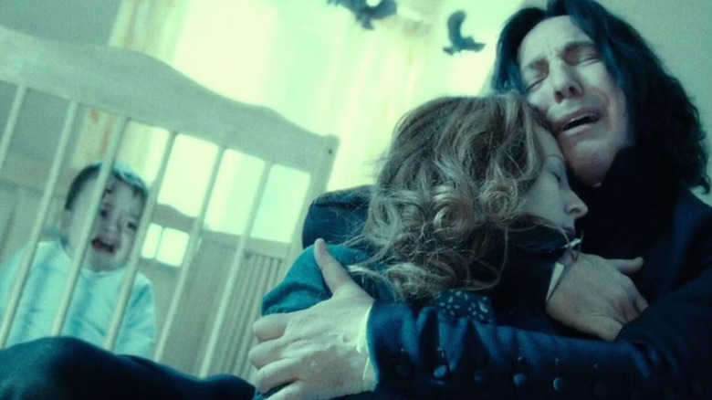 Baby Harry crying in his crib while Snape embraces a dead Lily in Harry Potter and the Deathly Hallows