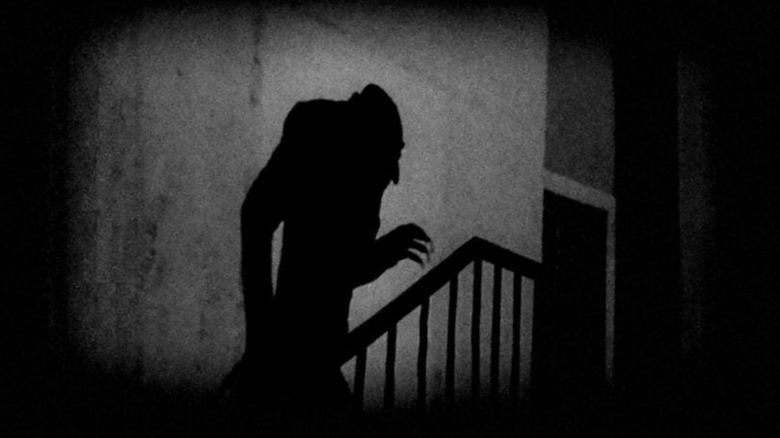 Count Orlok's shadow marching up the stairs in Nosferatu (1922)