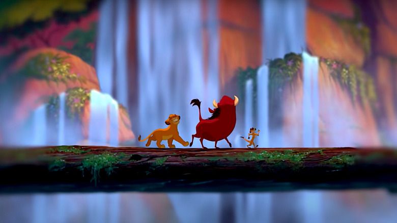 Simba, Timon, and Pumba walk across a log