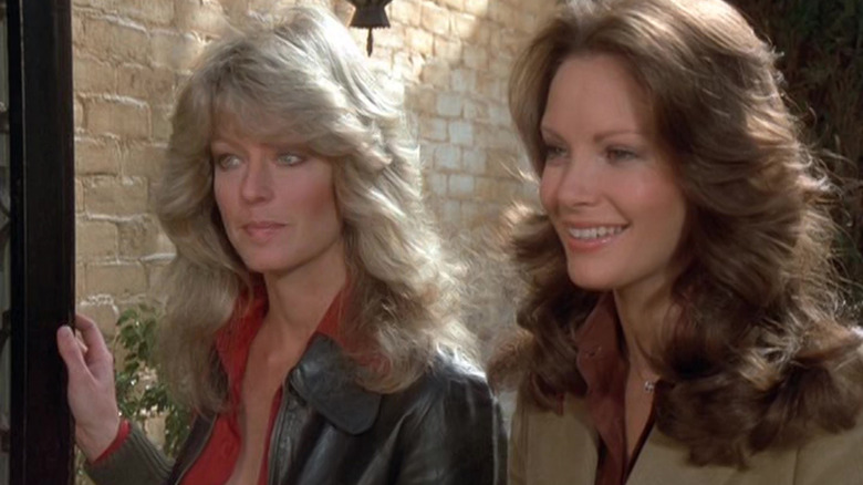 Jill and Kelly, doing investigative work ouside of someone's front door on an episode of Charlie's Angels