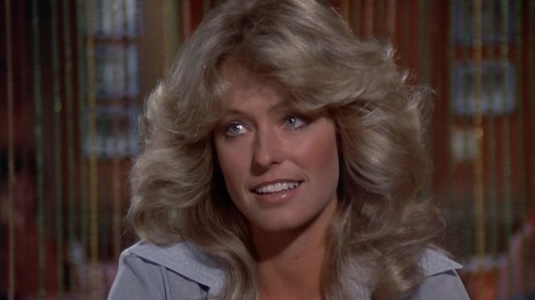 Jill Munroe, with fabuloys hair, smiling in an episode of Charlie's Angels