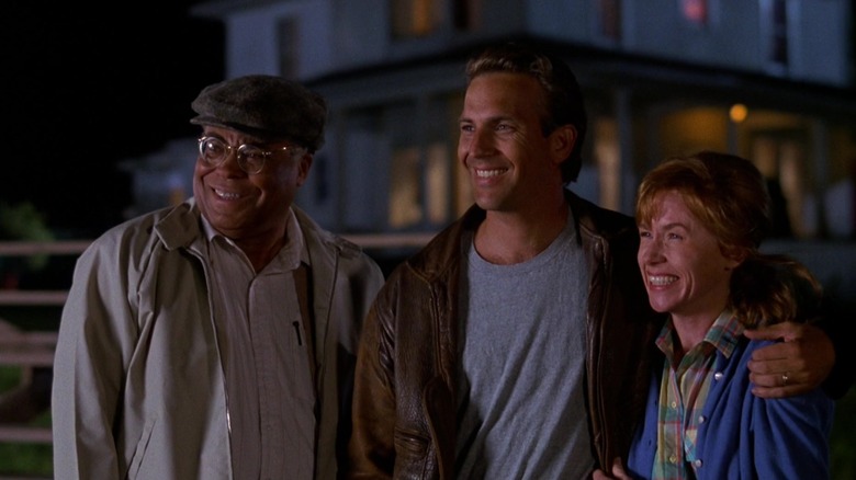 Terence, Ray, and Annie smiling together in Field of Dreams