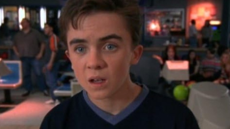 Frankie Muniz's Malcolm looks dumbfounded at a bowling alley in Malcolm in the Middle