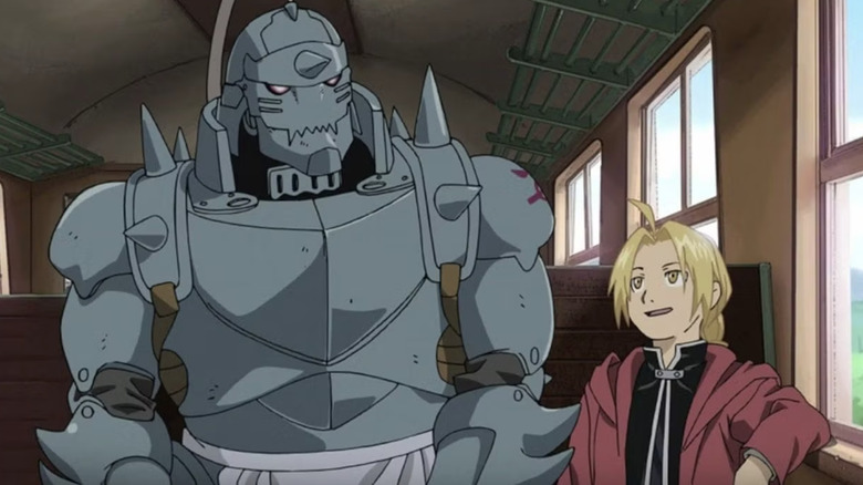 Elric Brothers sitting next to each other on a train in Fullmetal Alchemist