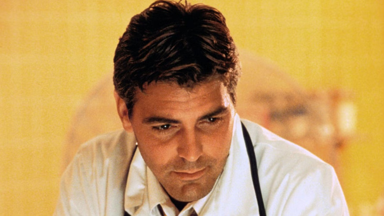 Doug ross in a warm light looking down on ER