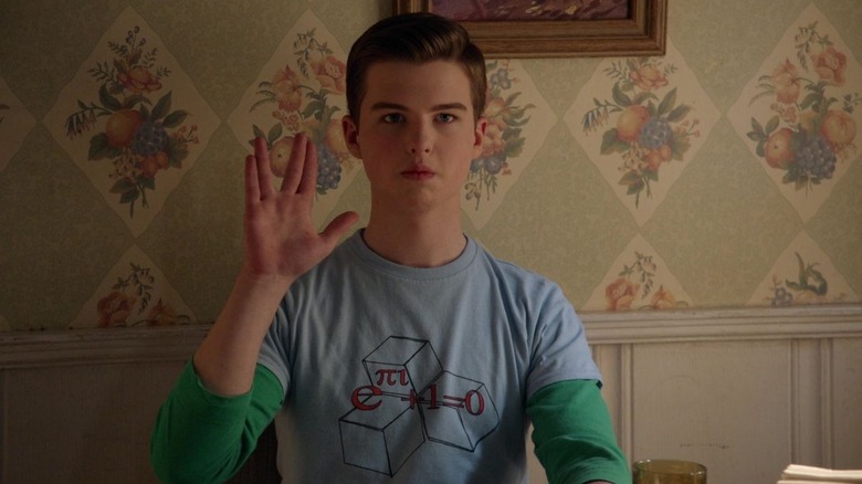 Iain Armitage as young Sheldon Cooper, his fingers parted in the 