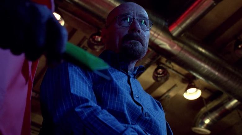 Breaking Bad scared Walter White looking up at Gus Fring, out of frame, with box cutter in hand