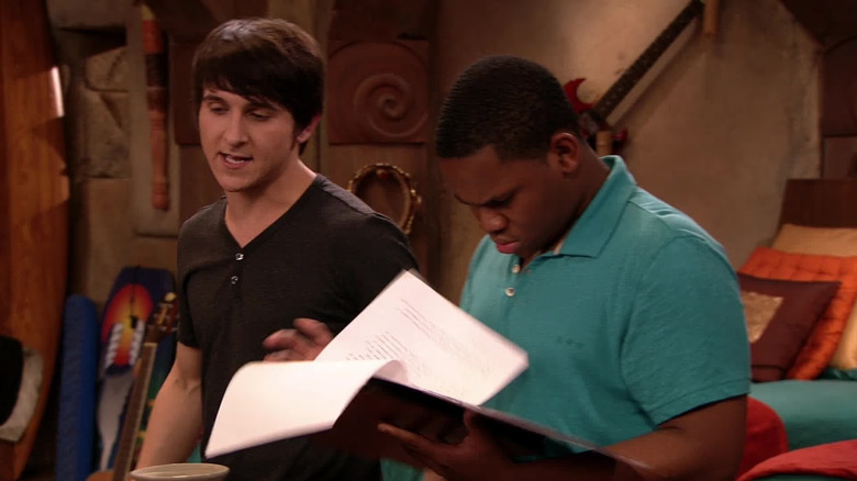 King Brady wears a pensive expression while King Duke leafs through papers on Pair of Kings