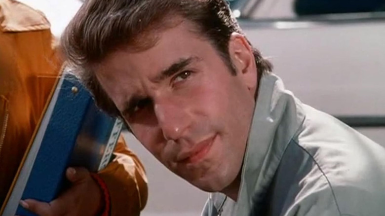 Henry Winkler as Fonzie looking to his left at something in Happy Days