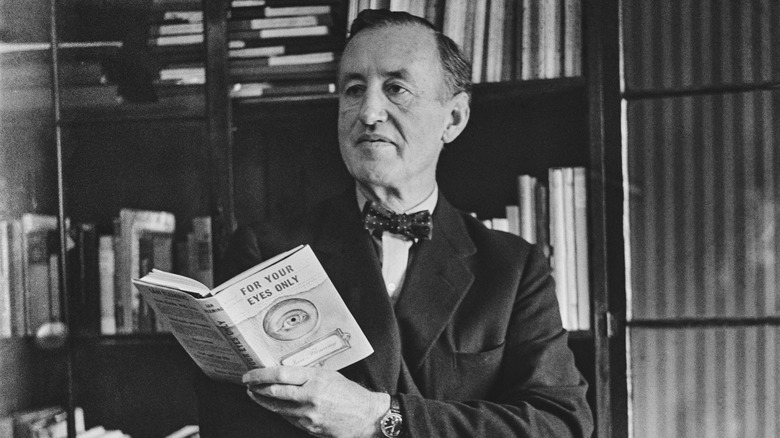 Ian Fleming holding a copy of For Your Eyes Only