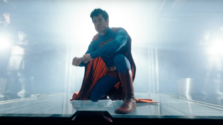 David Corenswet as Superman preparing to break through a fortress window in Superman (2025)