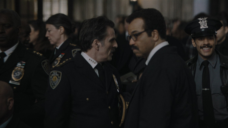 Con O'Neill as Chief Mackenzie Bock and Jeffrey Wright as Lieutenant Jim Gordon chatting in The Batman