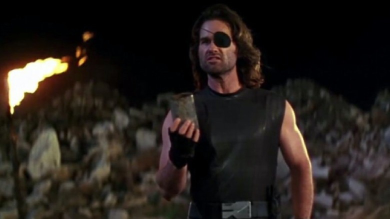 Kurt Russell holding can