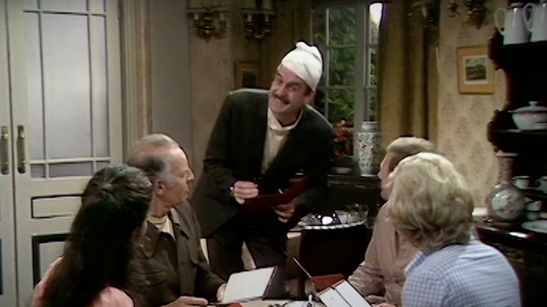 John Cleese playing Basil in Fawlty Towers