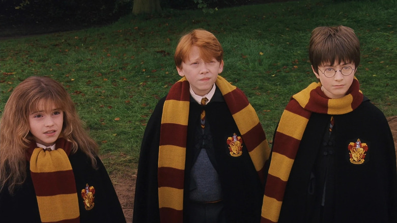 Hermione, Ron, and Harry wearing their Gryffindor scarves in Harry Potter and the Sorcerer's Stone,