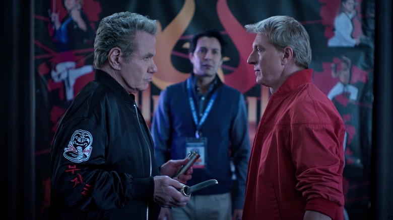 William Zabka's Johnny Lawrence staring intensely at Martin Kove's John Kreese in Cobra Kai