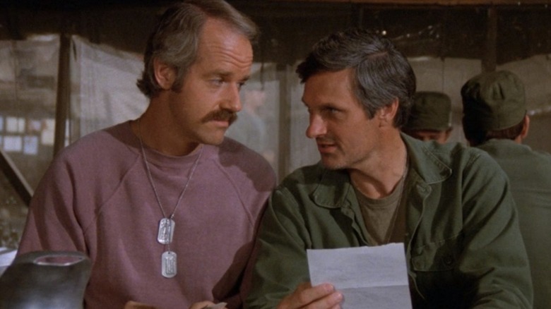 Mike Farrell as B.J. Hunnicutt and Alan Alda as Hawkeye having a conversation on M*A*S*H