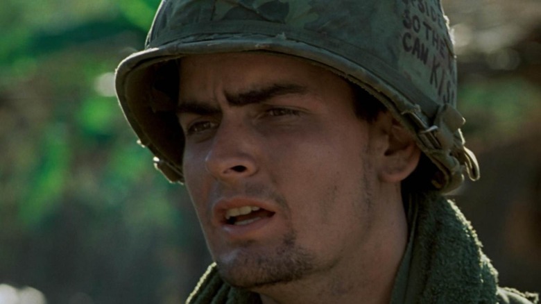 Charlie Sheen as Chris looking distraught in Platoon