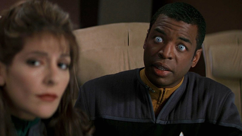 Geordi sitting at a conference table in Star Trek: First Contact