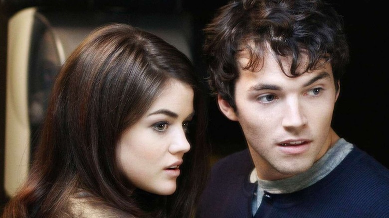 Ian Harding as Ezra Fitz and Lucy Hale as Aria Montgomery share a secret in Pretty Little Liars