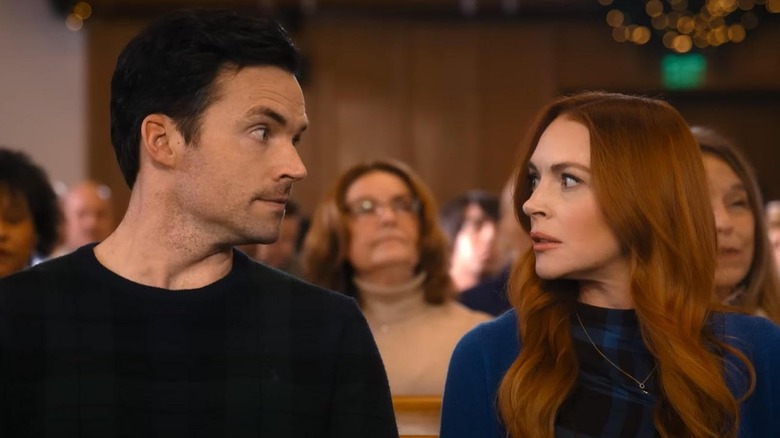 Ian Harding as Logan and Lindsay Lohan as Avery exchanging concerned looks in Our Little Secret