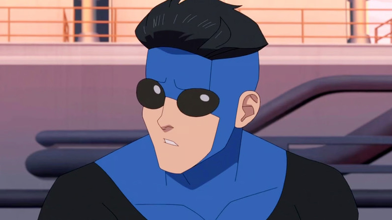 Mark Grayson looking worried in his blue suit in Invincible