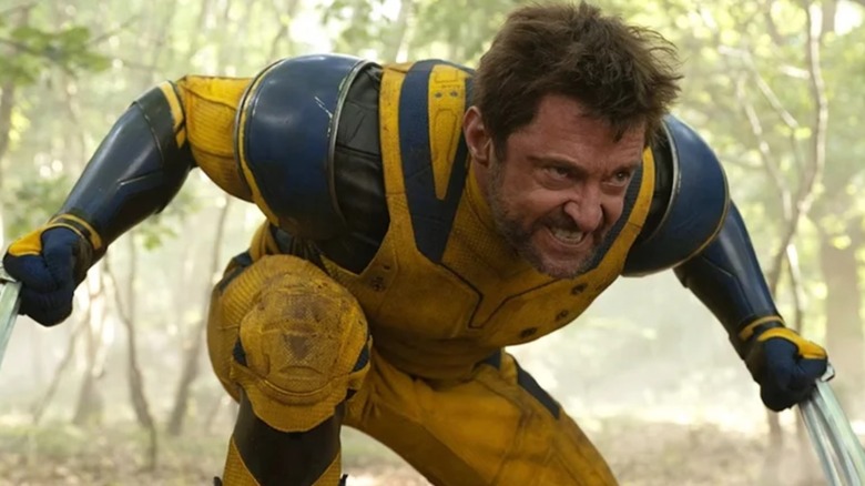 Hugh Jackman as Logan/Wolverine crouching with his claws in Deadpool & Wolverine