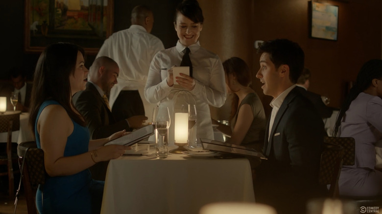 Mara Wilson as a waitress while Abby and Trey are on a date on Broad City