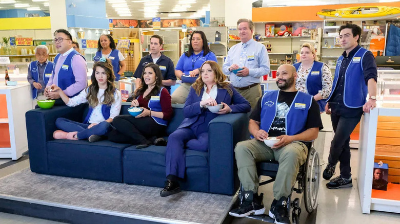 Mateo Marcus Cheyenne Amy Dina Garrett Sandra Glenn Justin and Jonah watching TV at the Superstore