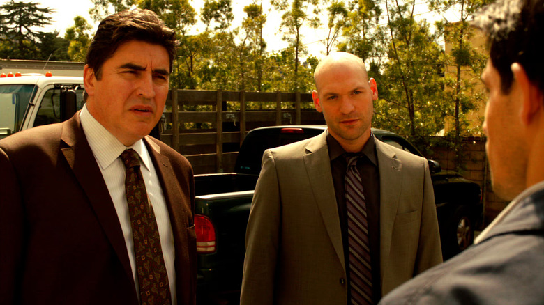 Detectives Ricardo Morales and TJ Jeruszalski interviewing someone on Law & Order: LA