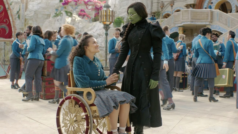 Nessarose and Elphaba in the courtyard at Shiz University in Wicked: Part One