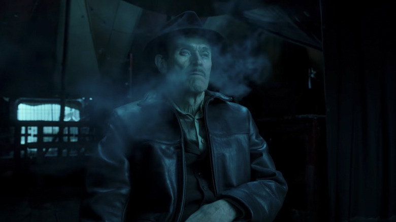 Willem Dafoe smoking in Nightmare Alley