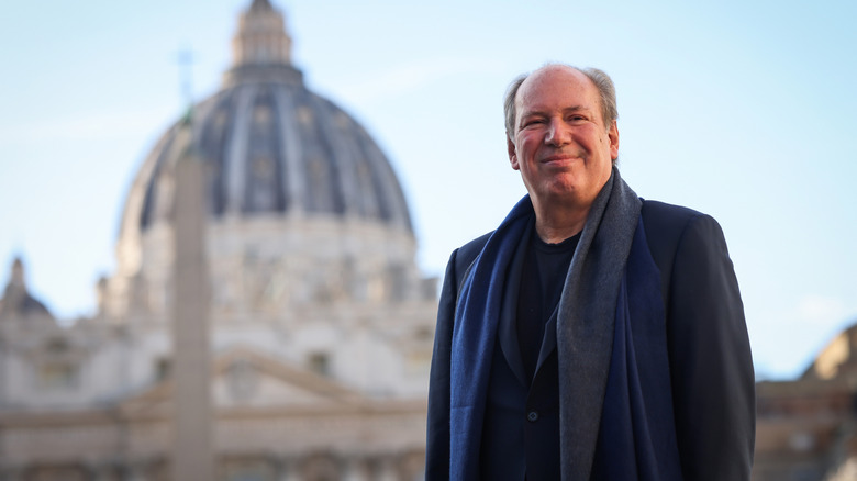 Hans Zimmer in the Vatican, smiling the cameras.