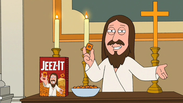 Jesus Christ holding up a cheese cracked called a Jeez-It