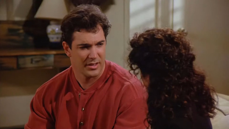 Patrick Warburton as David Puddy as a heart-to-heart with Julia Louis-Dreyfus as Elaine in Seinfeld