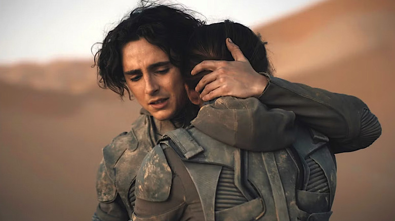 Paul and Chani embrace in Dune: Part Two