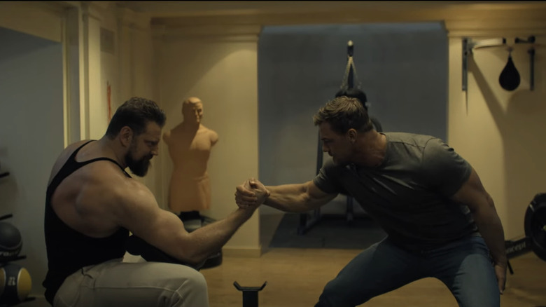 Olivier Richters' Paulie and Alan Ritchson's Jack Reacher arm wrestle in Reacher