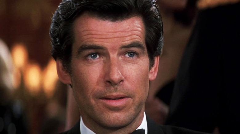 Pierce Brosnan's James Bond looks across frame while wearing a tuxedo in GoldenEye