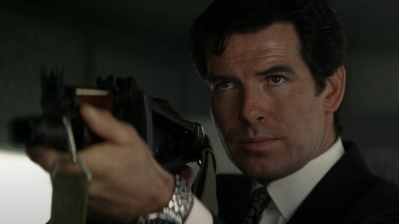 Pierce Brosnan's James Bond holds a gun in GoldenEye