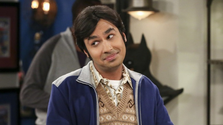 Raj with straight hair and his head cocked smirking on The Big Bang Theory