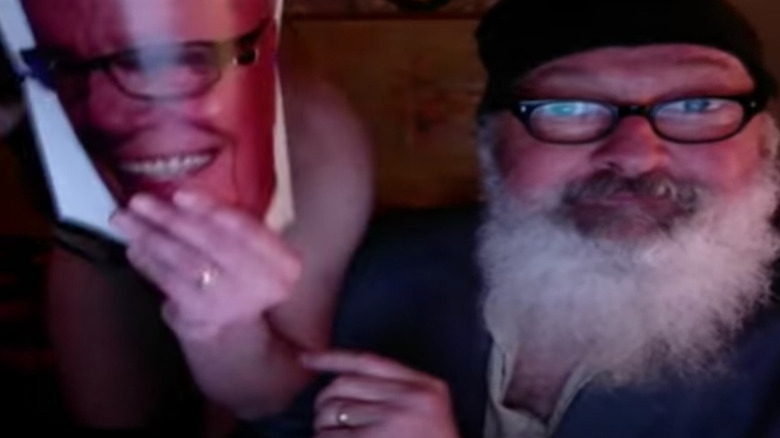 Randy Quaid prepares to fornicate with Evi Quaid as Rupert Murdoch in a home video