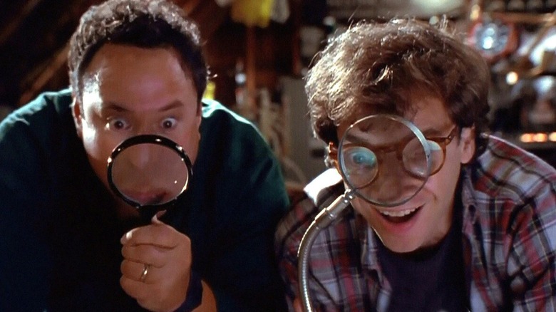 Wayne and Gordon looking through a magnifier glass in Honey, We Shrunk Ourselves