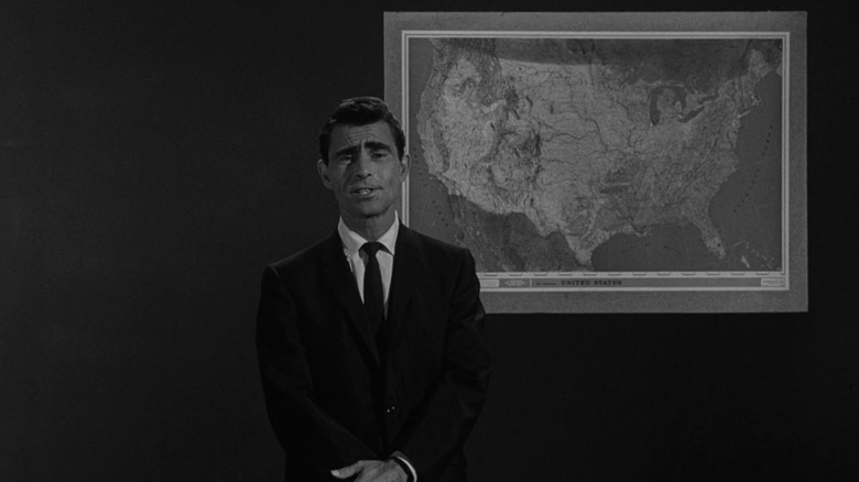 Rod Serling, standing in front of a map of the United States.