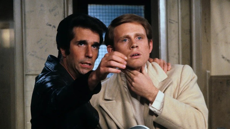 Henry Winkler as Fonzi gives wisdom to uncertain Ron Howard as Richie Cunningham in happy days