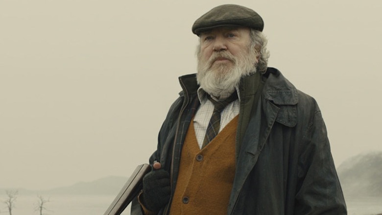 Albert Finney brandishes a shotgun as Kincade in Skyfall