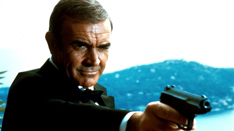 Sean Connery takes aim with a pistol as James Bond in Never Say Never Again