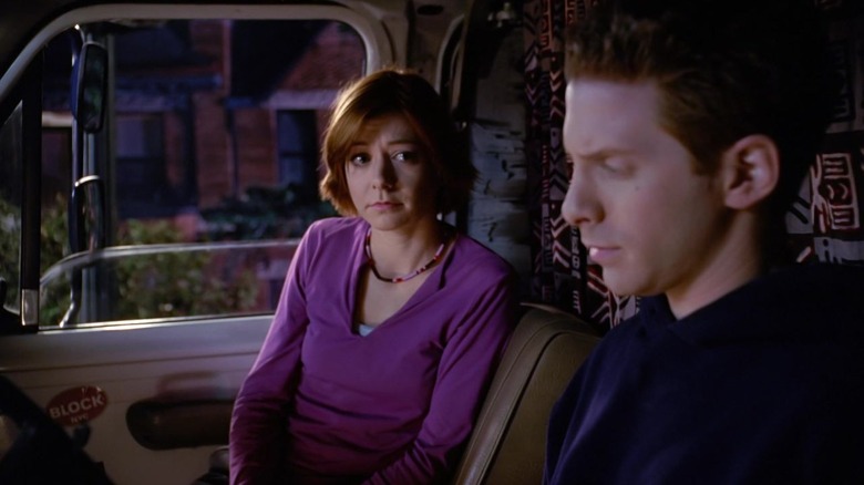 Willow and Oz sitting in a truck in Buffy the Vampire Slayer