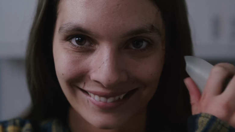 Caitlin Stasey as Laura in Smile
