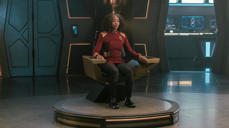 Sonequa Martin-Green as an older Captain Burnham sitting in her chair in Star Trek: Discovery