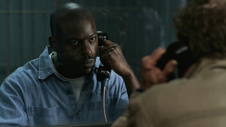 Gordon Walker on the phone in a prison on Supernatural